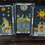 tarot cards on a wooden surface