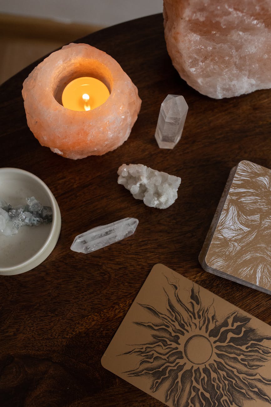 crystals and a candle on a table