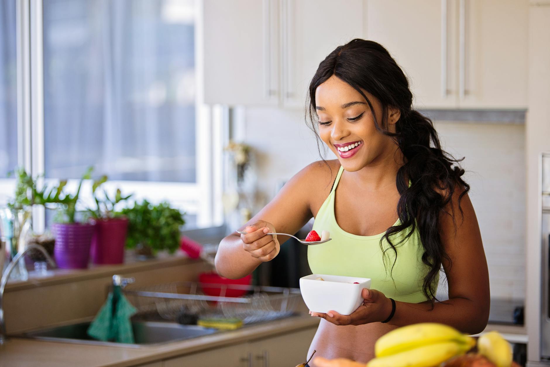 smiling woman eating healthy